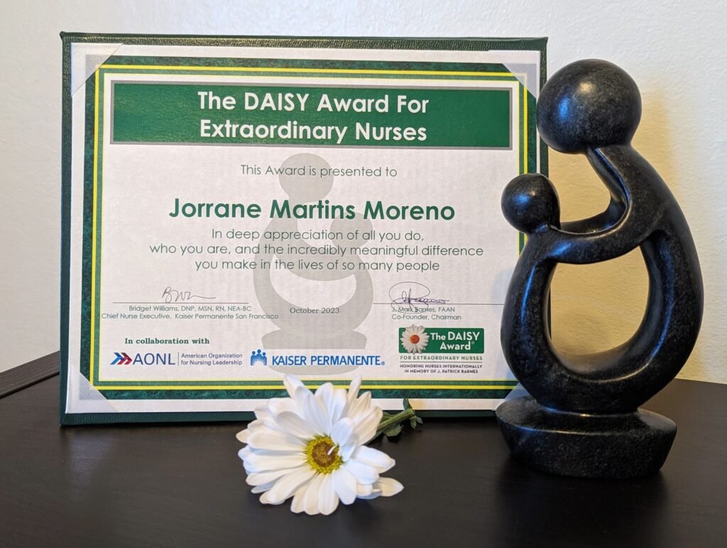 Photo of the daisy award nomination on the left with the statue on the right